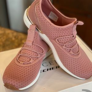 Rose colored Skechers sneakers